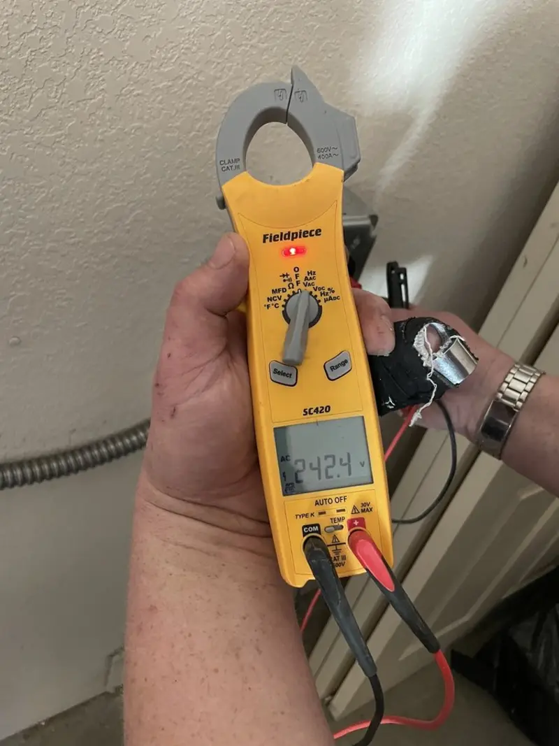 Voltage testing with clamp meter during Ceiling Fan Installation in Cortlandt
